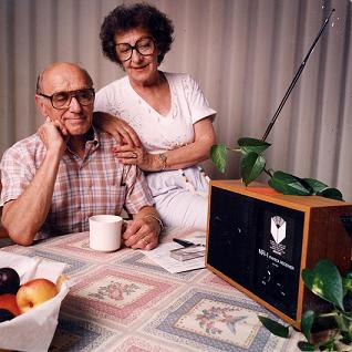 Photo of a couple listening to their specially tuned radio