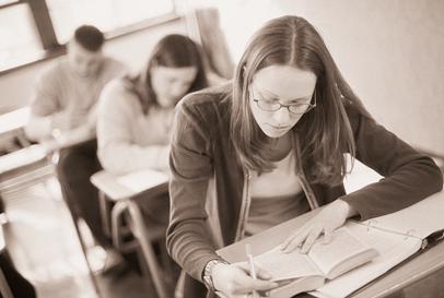 sepia tone photo of teens reading in class